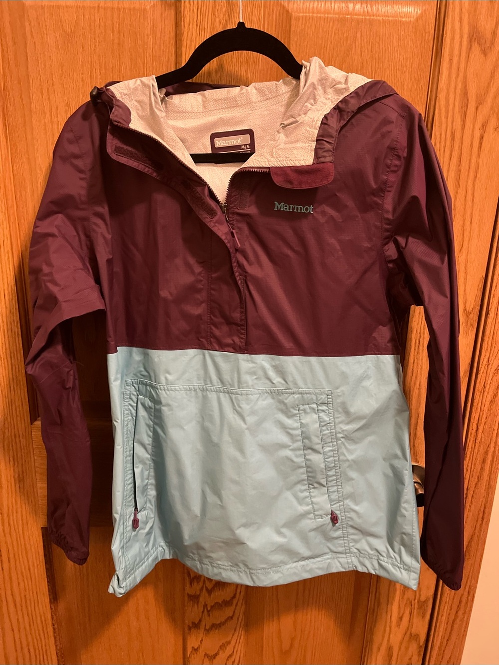Marmot Quarter-zip Wind Jacket with Plum Logo Patch and Light turquoise accents